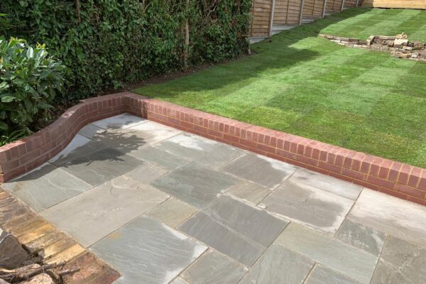 sandstone patio with retaining walls in welwyn garden city