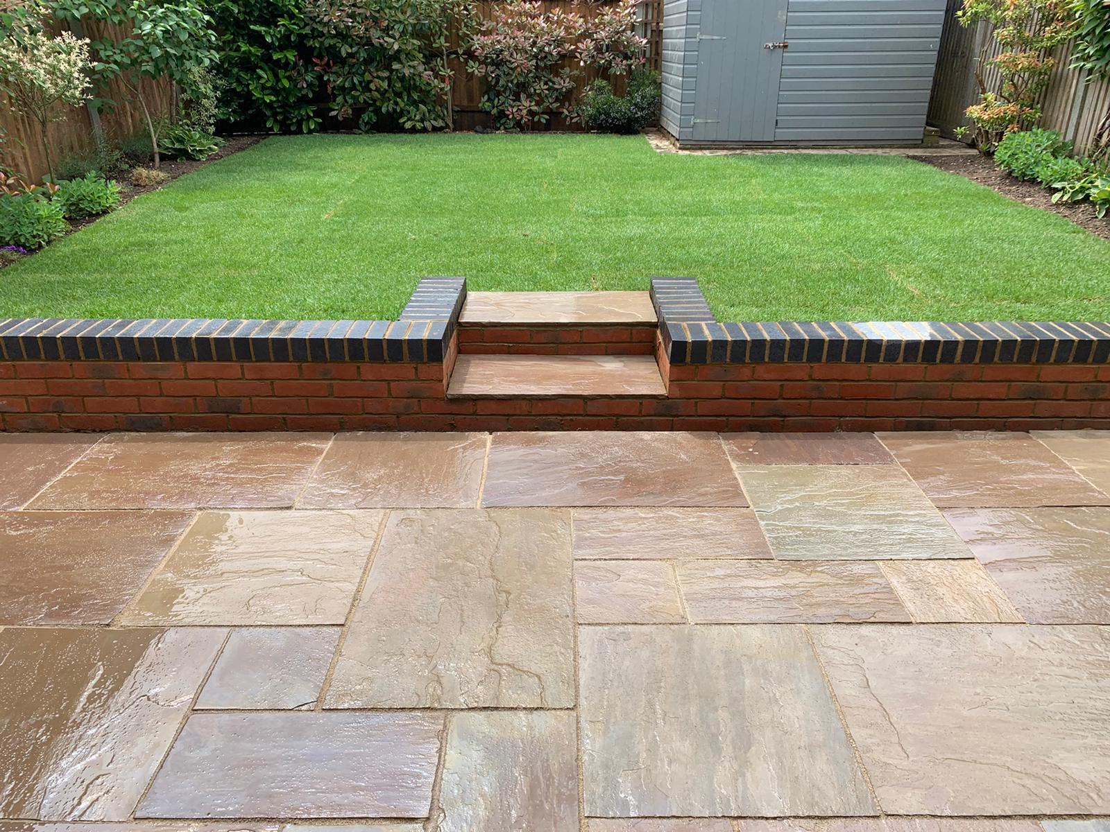 indian sandstone patio and new lawn laid in st albans