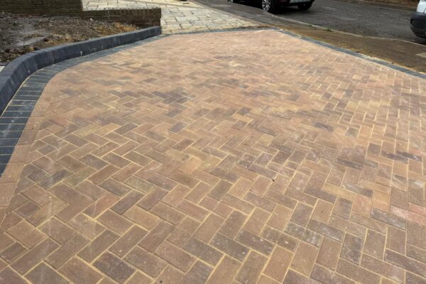 new block paved driveway with charcoal edge in Wheathampstead