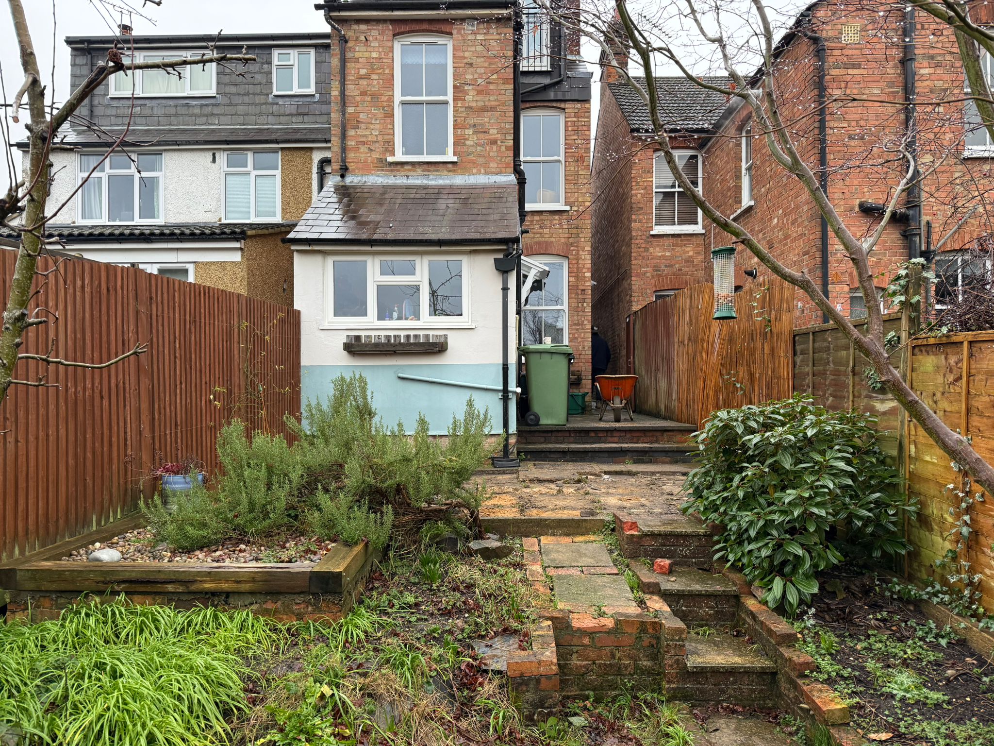 old patio replaced with sandstone paving in st albans